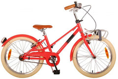 Volare Melody 20 inch meisjesfiets in koraal rood met handremmen, reflectoren, verlichting, bel, voordrager, standaard, verstelbaar stuur en extra lange zadelpen voor groei